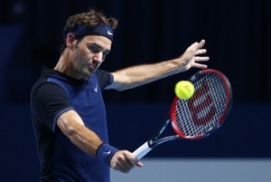 Federer of Switzerland returns the ball to Kohlschreiber of Germany during their match in Basel